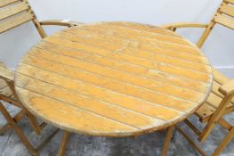 A set of six beech wood folding garden chairs,