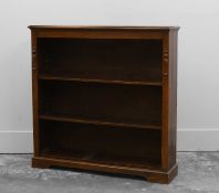 A oak open bookcase by James Colmer of Bath,