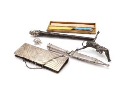 A collection of silver and white metal items,