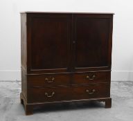 A George III mahogany linen press of diminutive size,