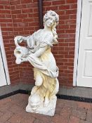 A pair of reconstituted garden figures of ladies,