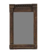 A carved and painted pier mirror,