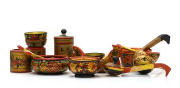 A collection of Russian Khokhloma painted spoons and bowls,