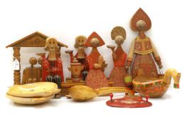 A collection of Russian Khokhloma painted kitchen wares and toys,