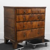 An oak and walnut chest of drawers,