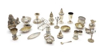 A collection of silver miniature items and condiments,