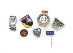 A quantity of motor racing and motor club lapel badges,