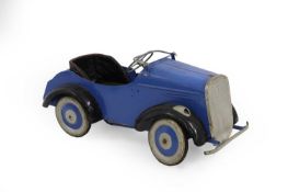 A child's tinplate pedal car,