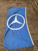 A Mercedes blue cloth flag,