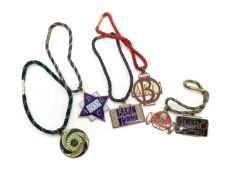 A collection of Brooklands BARC pre-war members' lapel badges,