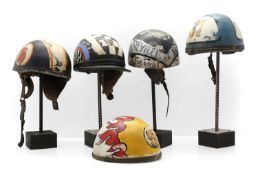 A group of motorcycle helmets,