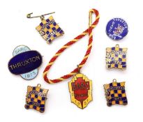 A collection of BARC Goodwood and Thruxton post-war members' lapel badges,