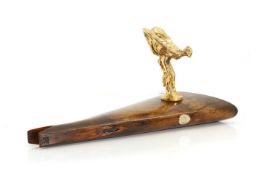 A gilded 'Spirit of Ecstasy' car mascot,