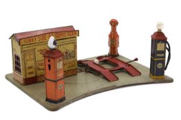 A 'Sunny Side Service Station' tinplate toy garage with electric illumination by Marx,