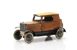 A tinplate clockwork toy car by Burnett,