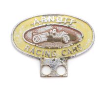 An Arnott Racing Cars owner's car badge,