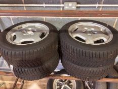 A set of four Mercedes W124 alloy wheels,