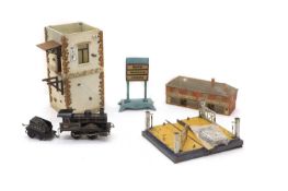 A collection of vintage model railway buildings and accessories,