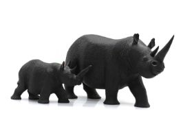 Two carved hardwood rhinoceroses,