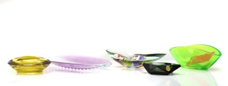 A group of five glass bowls,