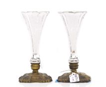 A pair of French glass and brass bud vases,
