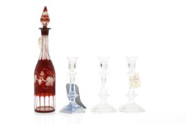 A set of three Baccarat candlesticks,