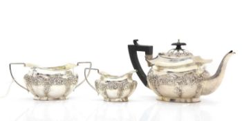 A silver three piece tea service,