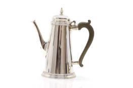 A silver coffee pot,