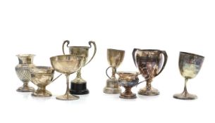 A collection of miniature silver trophies,