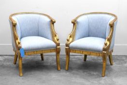 A pair of upholstered tub chairs,
