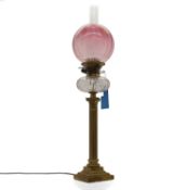 A duplex brass oil lamp,