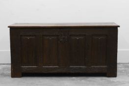 An oak four panelled linen fold carved coffer,