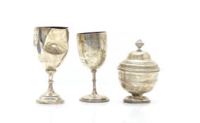 Three silver trophy cups,