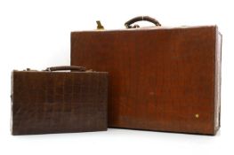 A crocodile skin suitcase,
