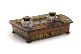 A Regency rosewood desk stand with brass inlay,