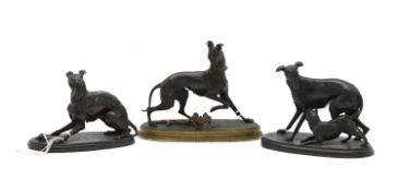 A bronze group of a whippet and a butterfly,