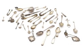 A collection of silver flatware and trinkets,