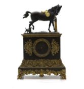 A gilt and patinated bronze mantel clock,