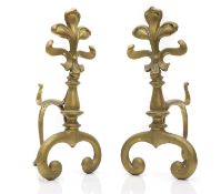 A pair of brass fleur-de-lis andirons,