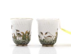 A pair of porcelain beakers,
