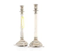 A pair of silver plated candlesticks,