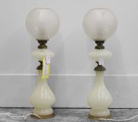 A pair of opaline glass lamps,