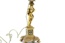 A French ormolu and champlevé candlestick,