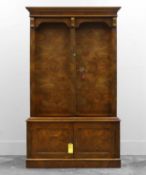 A figured walnut gun cabinet,