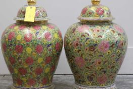 A pair of Thai porcelain temple jars and covers,