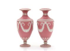 A pair of pink jasperware vases,