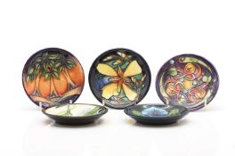 A collection of five Moorcroft coasters,