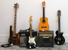 A collection of guitars,