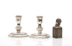A pair of dwarf silver candlesticks,