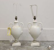 A pair of creamware style table lamps,